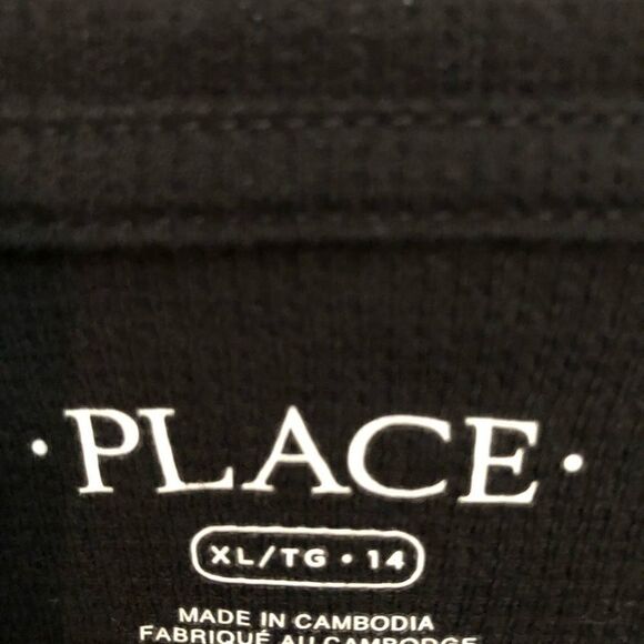 Black waffled Place Long sleeve shirt with two silver buttons at boat neck. - Picture 4 of 5